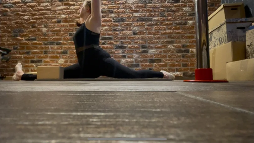 Ania in a full front split, left leg forward